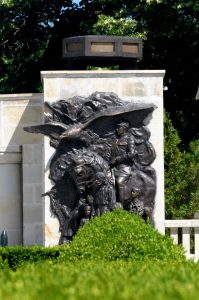 Bronze bas-relief at Mărăști Mausoleum, showing an officer on horseback, civilians, and a soaring eagle