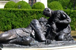 Bronze sculptural group by Aurel Bordenache depicting a wounded soldier tended on the battlefield at Mărăști