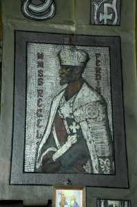 Wall mosaic depicting King Ferdinand wearing a crown and royal mantle