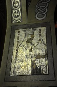 Votive mosaic depicting Queen Marie wearing a crown and holding a church model