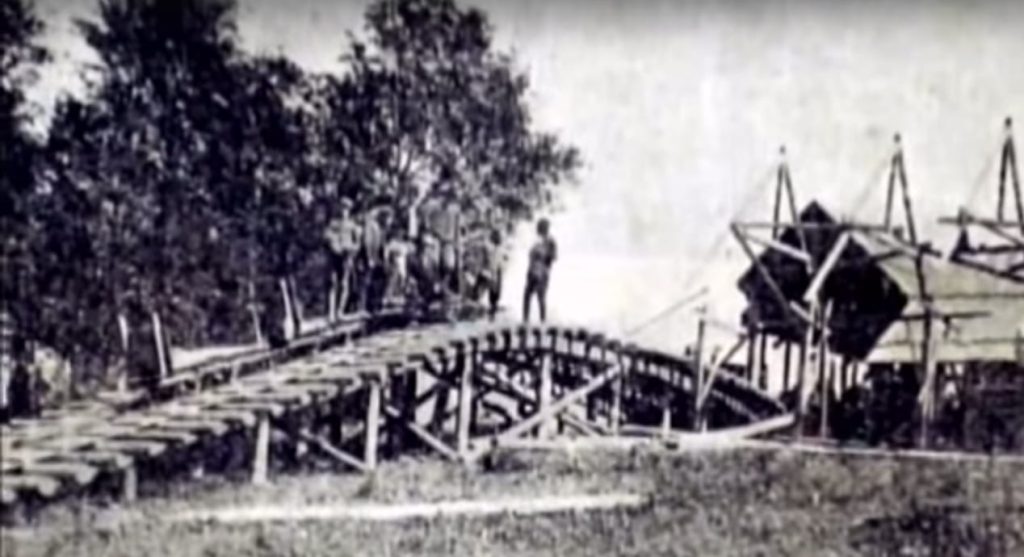 Group of soldiers and workers on a wooden funicular structure