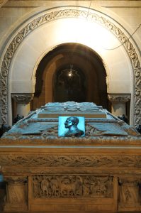 Sculpted sarcophagus inside the Mărăști Mausoleum, featuring a bronze bas-relief profile of an officer