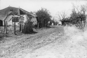 Village dirt road with peasant houses damaged during the Battle of Mărăști