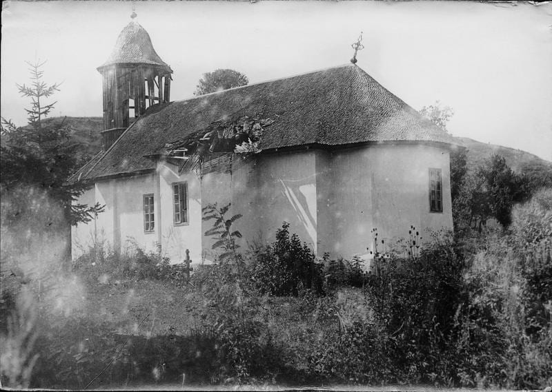 Damaged church in Mărăști during World War I, showing a broken roof and damaged bell tower