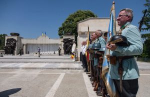 Historical reenactors in World War I uniforms lined up at the Mărăști Mausoleum